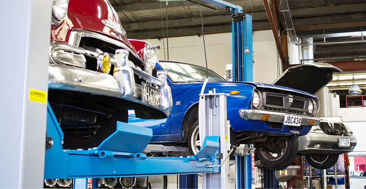 Marshall Transmissions Classic cars raised on hoists inside the Marshall Automotive workshop